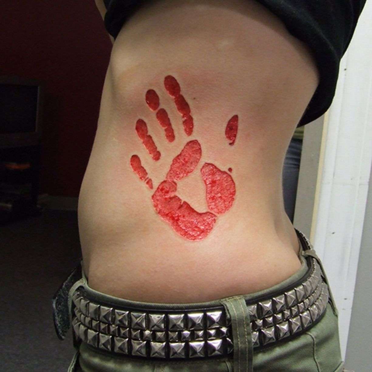 Sacrificial tattoo trend sees people cut, burn and etch skin
